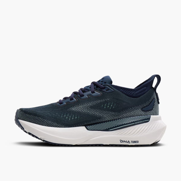 Navy running shoe with white sole on a white background