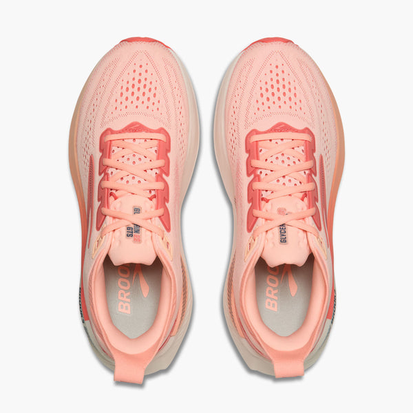 Pair of pink running shoes on a white background
