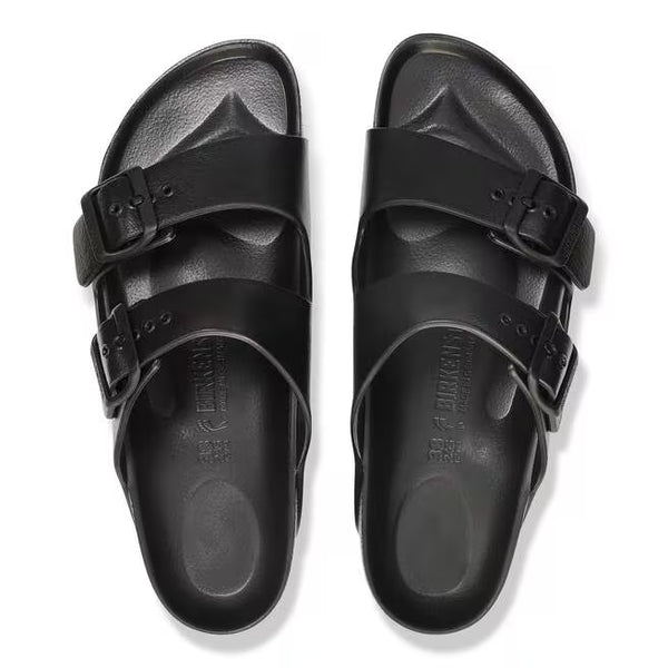 The buckles on the straps of this sandal are black and the sole of the shoe has Birkenstock printed vertically. 