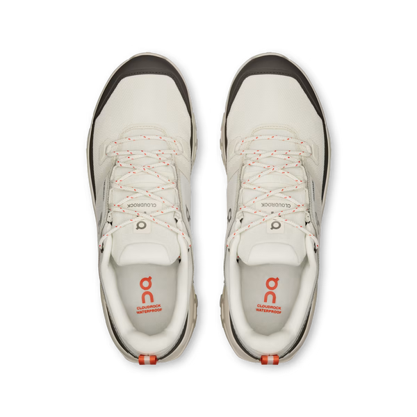Grey and cream hiking shoe on a white background