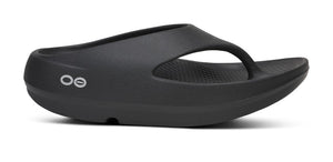 Chunky black thong sandal on a white background