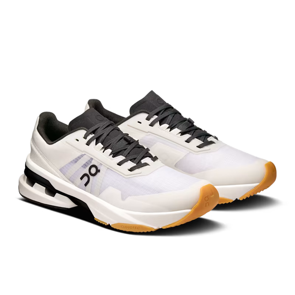 White running shoe with black and brown accents on a white background