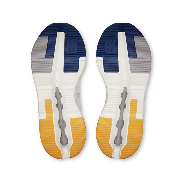 Pair of shoe insoles with blue, gray, and yellow design on a white background