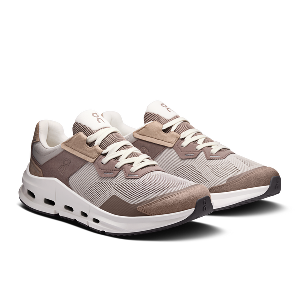 Pair of brown and gray sneakers on a white background
