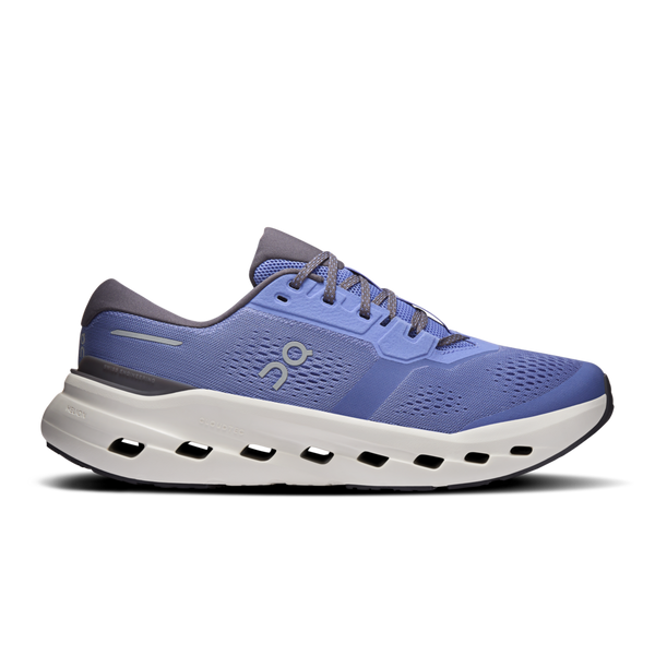 Blue men's running shoe with white sole on a white background and black laces.