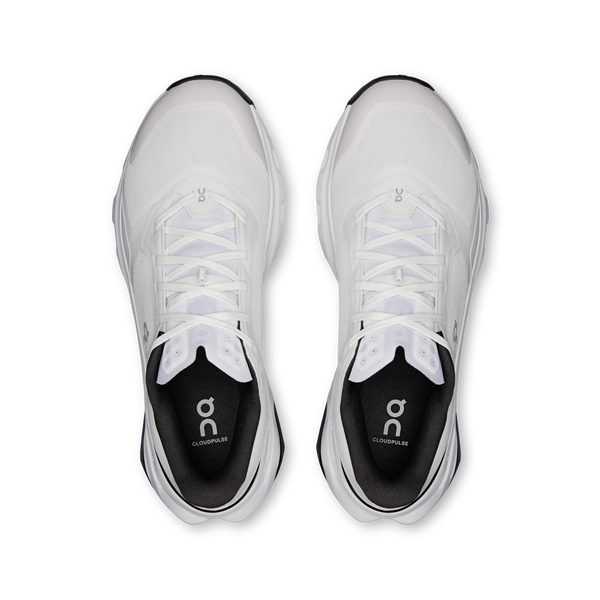 White running shoes with black soles on a white background