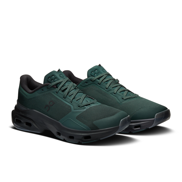 Pair of green athletic shoes on a white background