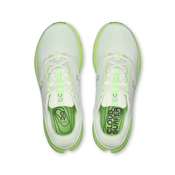 White and lime green ombre running shoe on a white background
