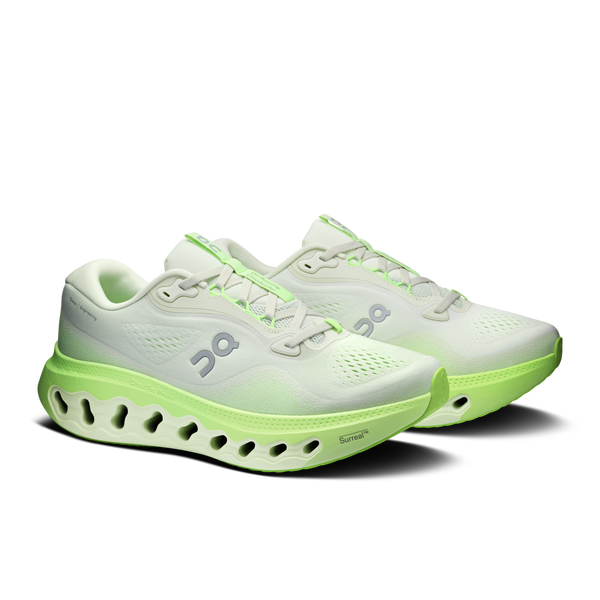 White and lime green ombre running shoe on a white background