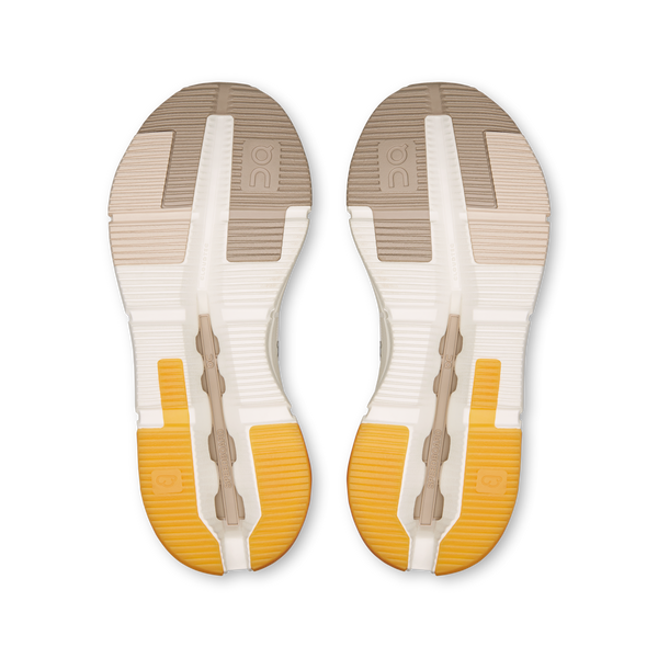 Pair of white insoles with yellow soles on a white background
