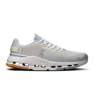 Light gray running shoe with blue accents on a white background