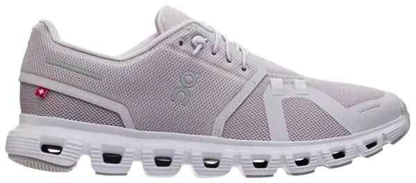 Purple and white athletic shoe on a white background