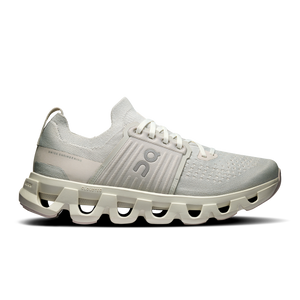 Light gray athletic shoe with unique sole design on a white background
