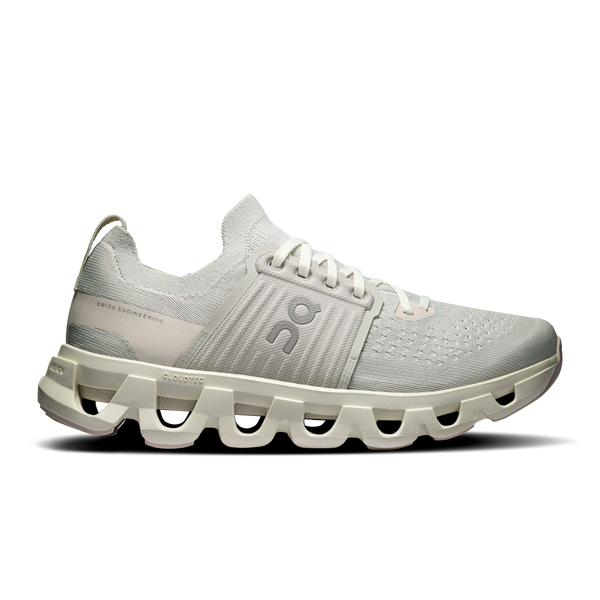 Light gray athletic shoe with unique sole design on a white background