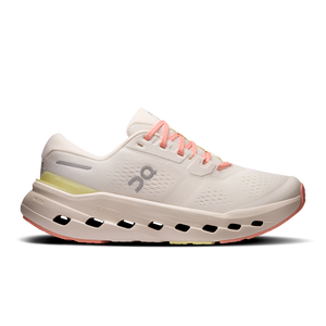 White running shoe with pink accents on a white background
