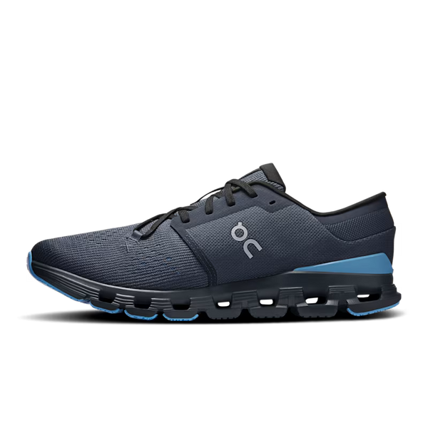 A dark navy blue running shoe with a textured knit upper, black laces, a black midsole with visible air pockets, and light blue accents on the heel and outsole, shown from a side profile on a white background.