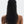Person with long, dark hair styled in a ponytail against a white background