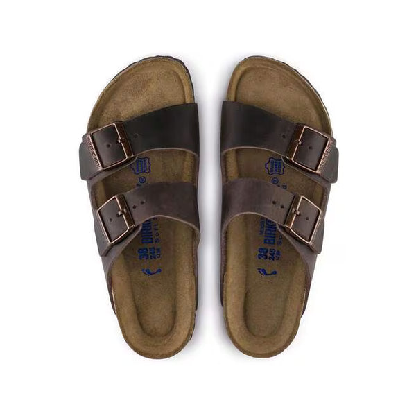 The upper of this shoe is two large straps with buckles on the lateral sides. 