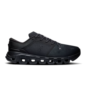 A black On gym shoe with a chunky, sculpted sole and textured mesh upper, shown in a side profile on a white background.