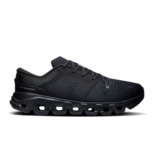 A black On gym shoe with a chunky, sculpted sole and textured mesh upper, shown in a side profile on a white background.