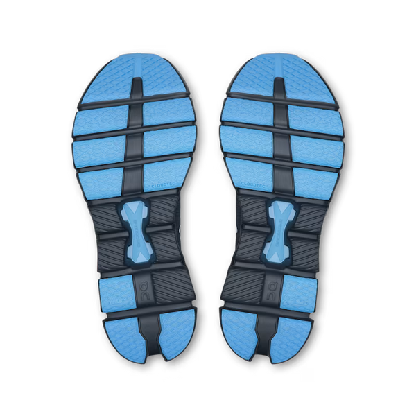 Blue and black shoe sole with a visible brand logo on a white background