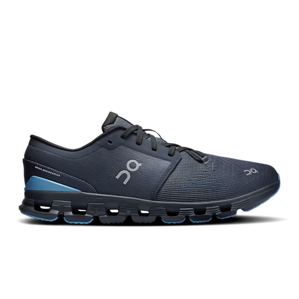 Navy running shoe with blue sole on a black background