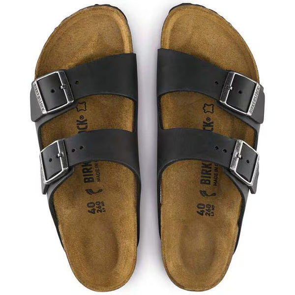 The upper of this shoe is two large straps with buckles on the lateral sides. 