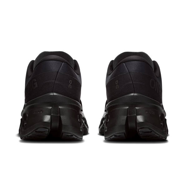 Black athletic shoes shown from the back on a white background