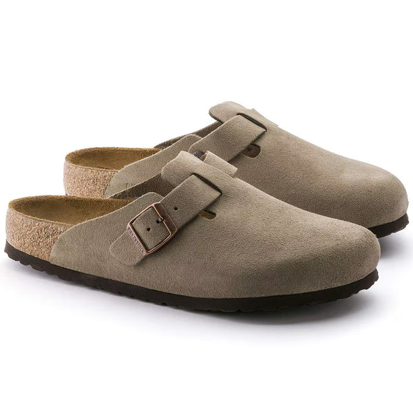 A strap runs through the top of the upper with a buckle to tighten it. 