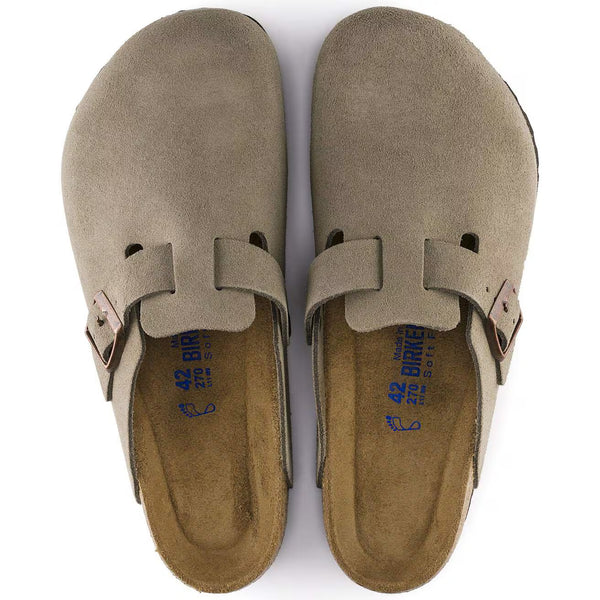 The upper of this shoe is taupe and has brass buckles. 
