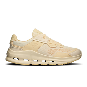 Tonal light yellow sneaker with laces to match.