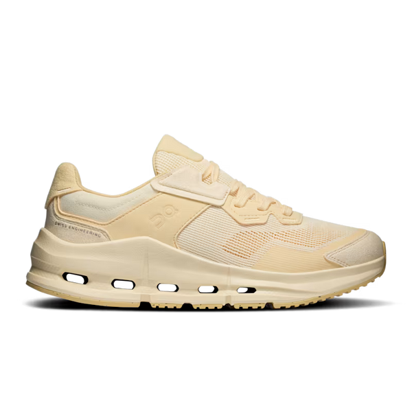 Tonal light yellow sneaker with laces to match.