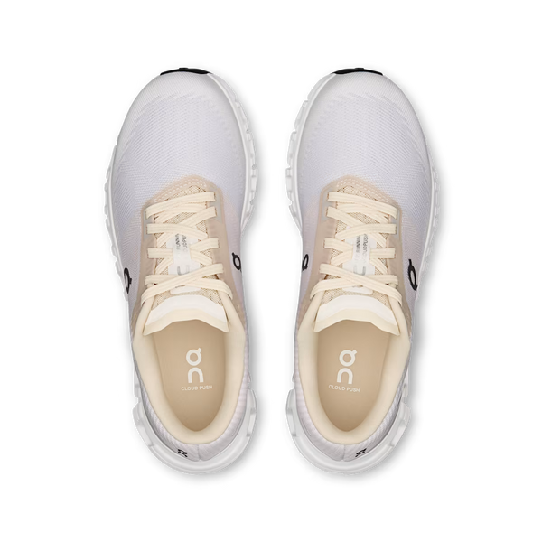 Light purple, cream and white training shoe on a white background