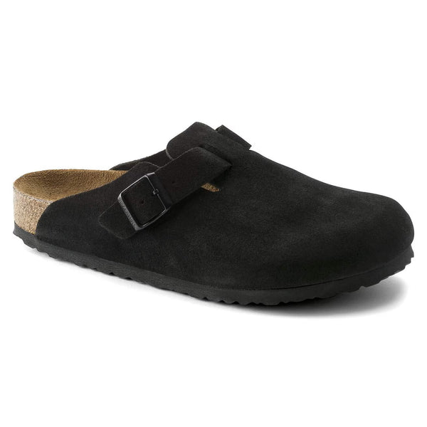 Black suede clog on a a white background