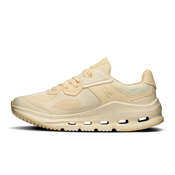 White and pink running shoe with 'On' branding on a white background