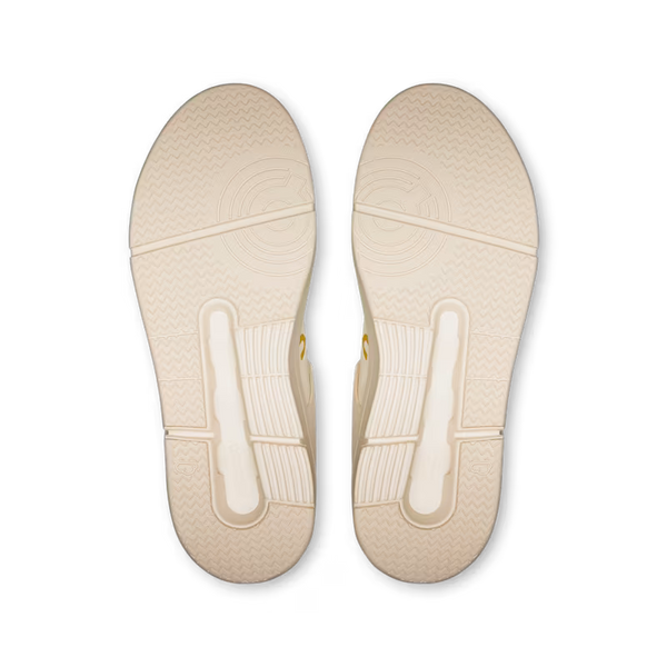 Top-down view of a pair of beige shoe insoles showing the textured tread patterns and support zones, set against a plain white background.