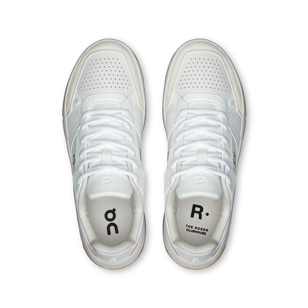 White sneakers with brand logos on a white background