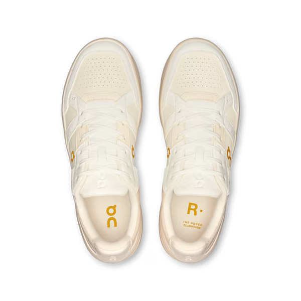White sneakers with yellow accents on a transparent background