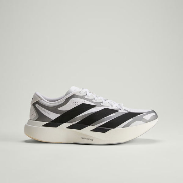 A adidas runnig shoe with the words lightstrike Pro in small lettering along the midsole.