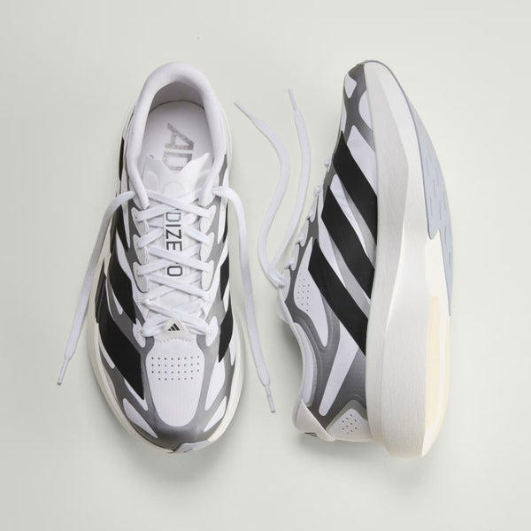 A pair of men's adidas shoes sitting at 2 differnet angles.