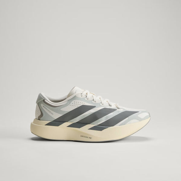 An adidas running shoe with 3 big stripes that go from the upper through the midsole