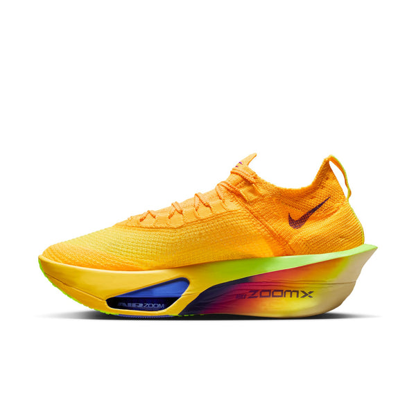 Brightly colored running shoe with 'zoom x' on a white background