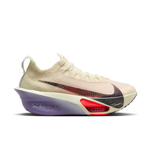 Beige running shoe with purple sole on a white background.