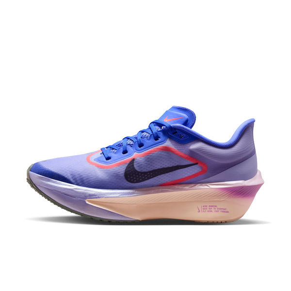 The medial side of a purple and blue running shoe with Nike logo on a white background