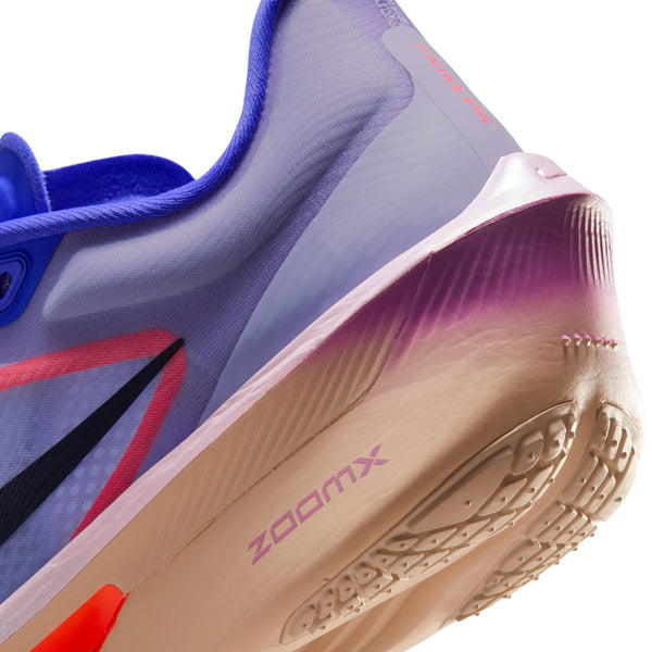 Close-up of a sports shoe with 'zoomx' branding on a white background