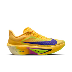 Yellow running shoe with purple swoosh logo on a white background