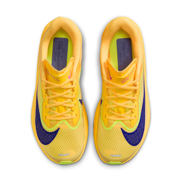 Yellow and purple running shoes on a white background
