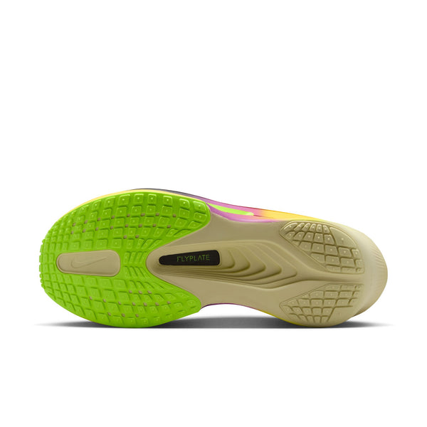 Close-up of a shoe sole with green and beige color on a white background