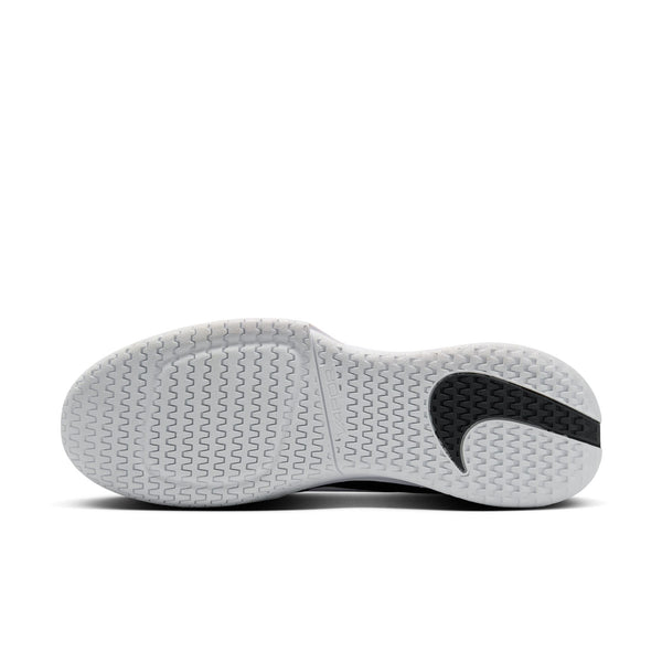 The outsole of this Nike Tennis shoe is mostly all white except for the black Swoosh.
