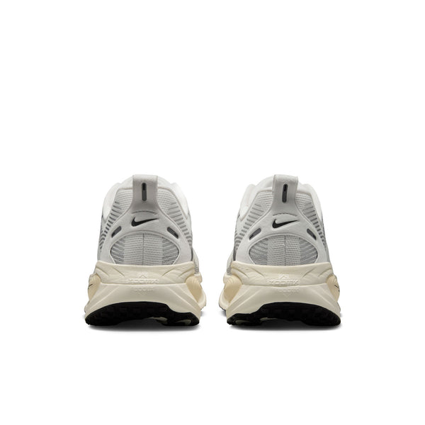 Pair of white sneakers with Nike logo on a white background